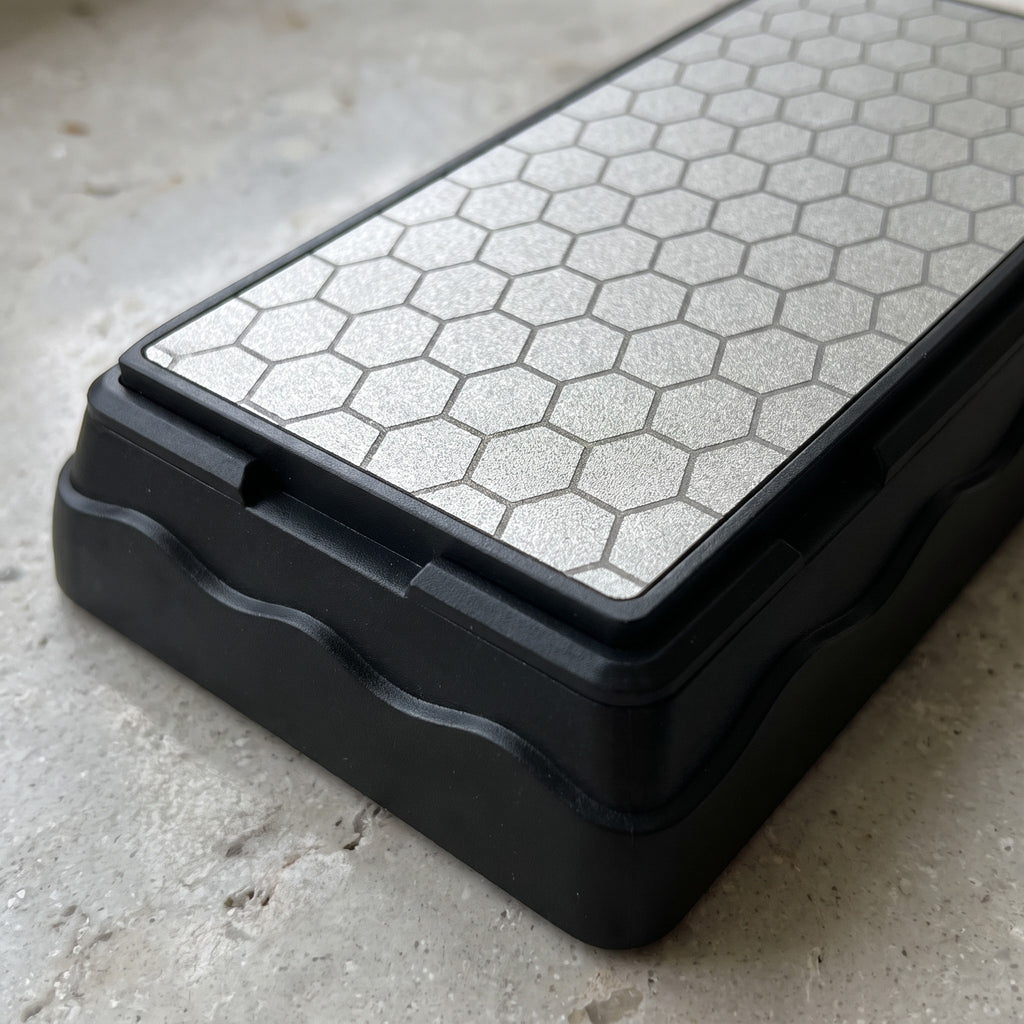 1000 Grit Diamond Knife Sharpening Stone with Non-Slip Base - close-up of the honeycomb diamond surface and black non-slip base