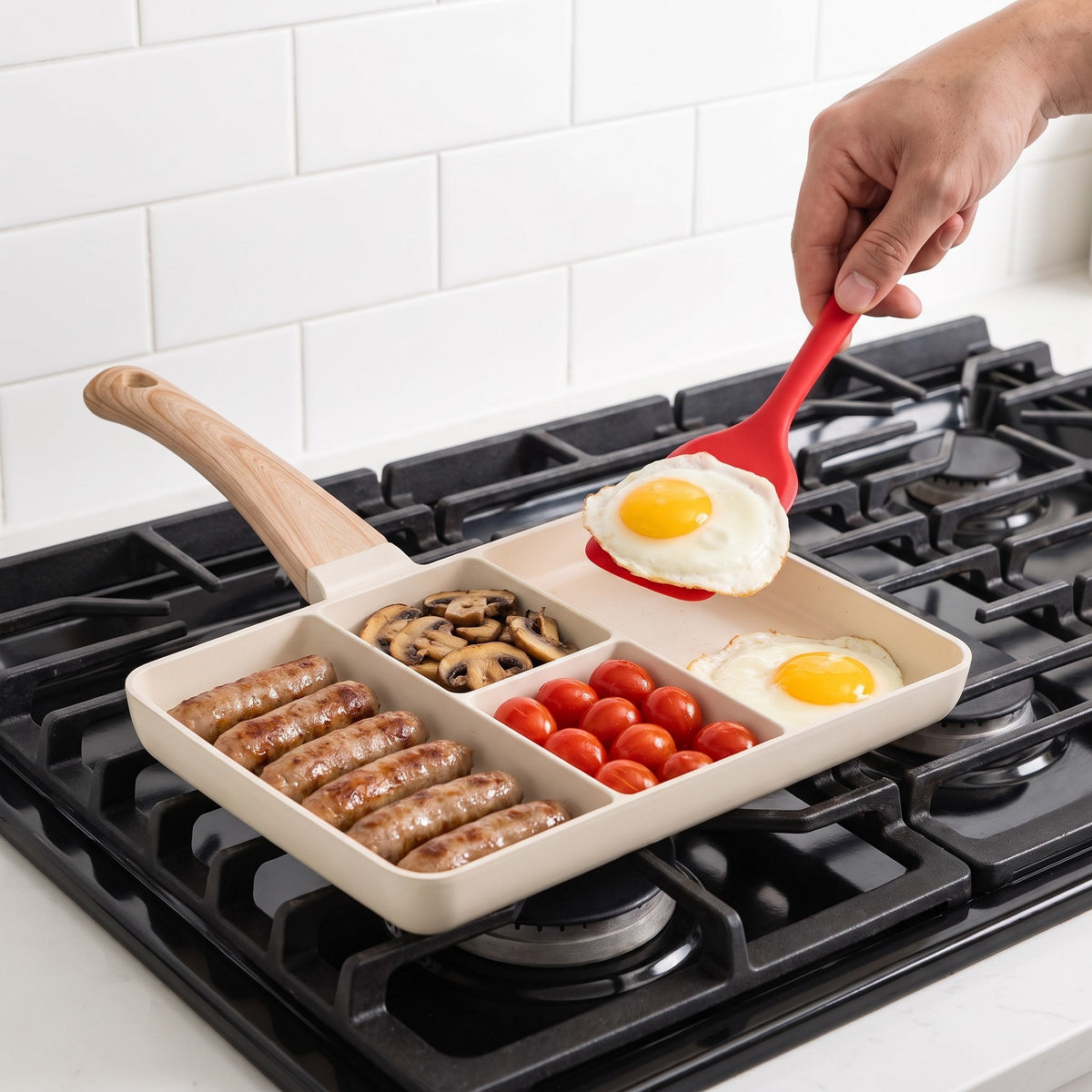 4-Compartment Non-Stick Divided Frying Pan with Soft-Touch Handle in use, cooking sausages, mushrooms, tomatoes and eggs