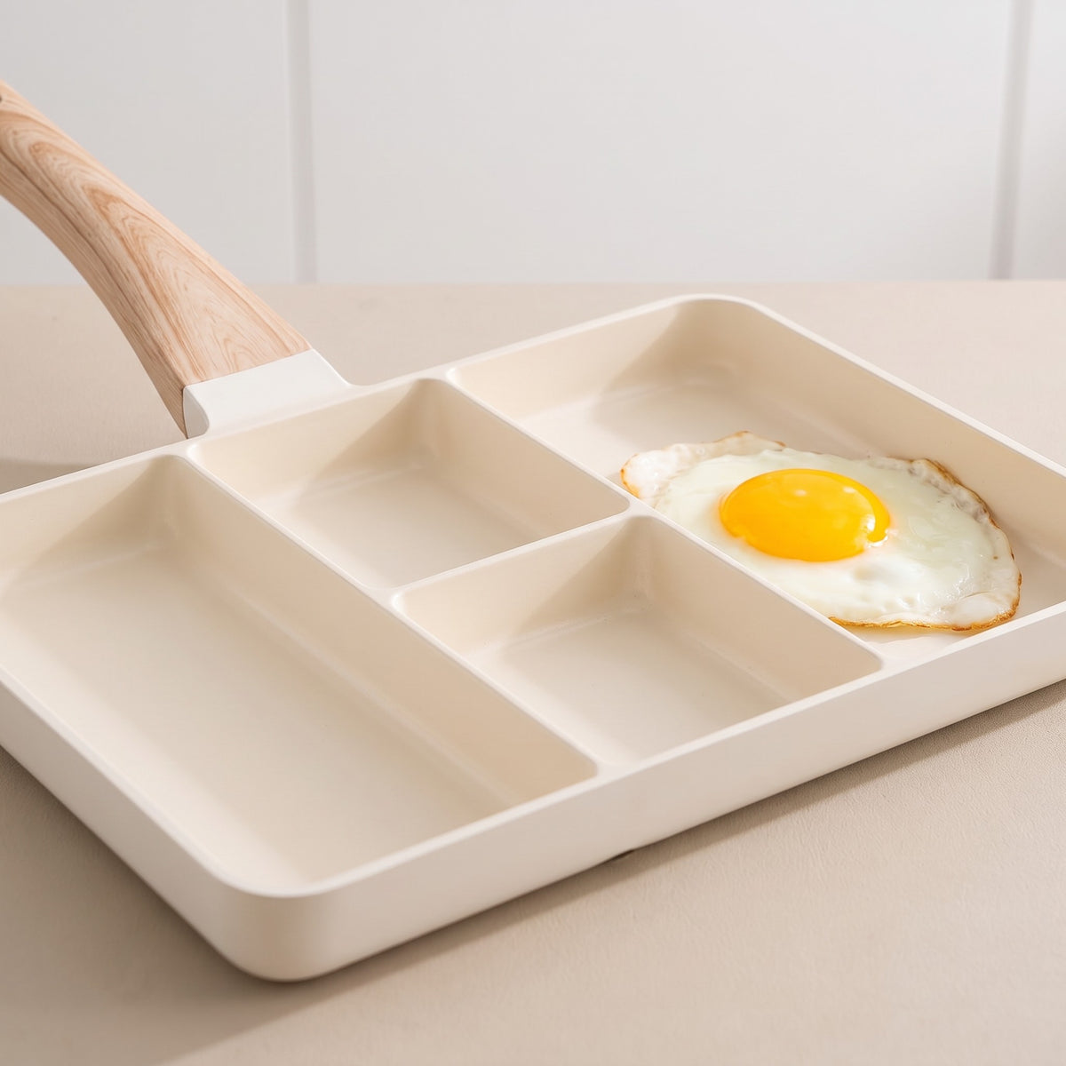 4-Compartment Non-Stick Divided Frying Pan with Soft-Touch Handle - close-up of the cream non-stick coating and compartment dividers