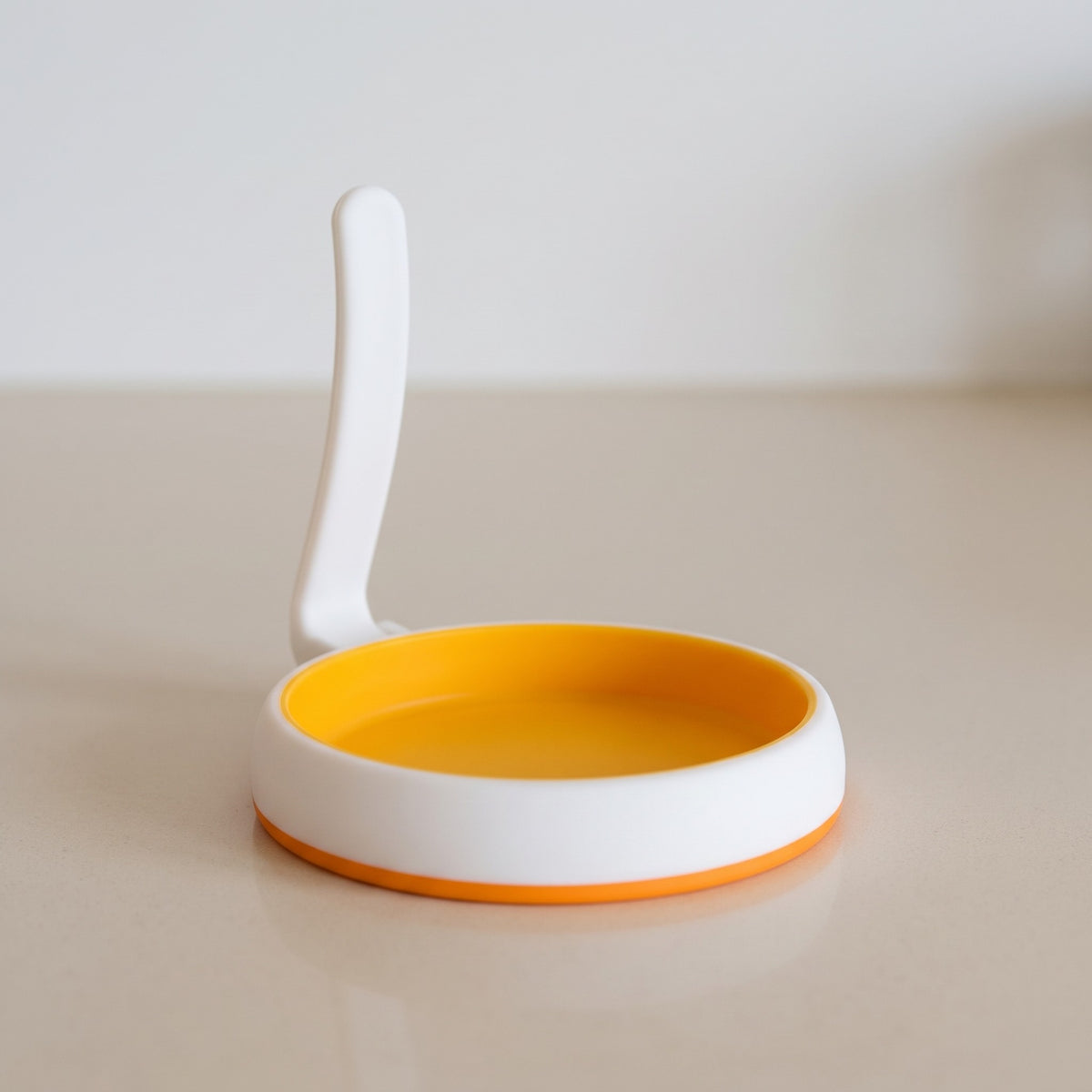 4-Inch Silicone Egg and Pancake Rings for Breakfast Sandwiches - close-up of the silicone ring and curved handle
