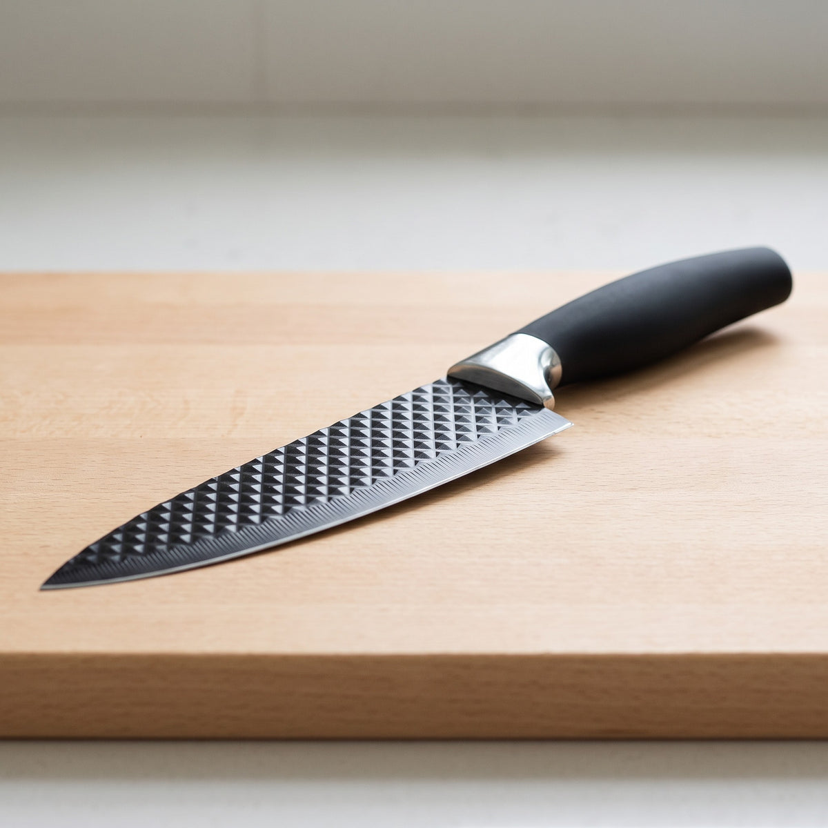 6-Piece Stainless Steel Knife Set with Kitchen Scissors and Peeler - close-up of the textured blade, bolster and non-slip handle