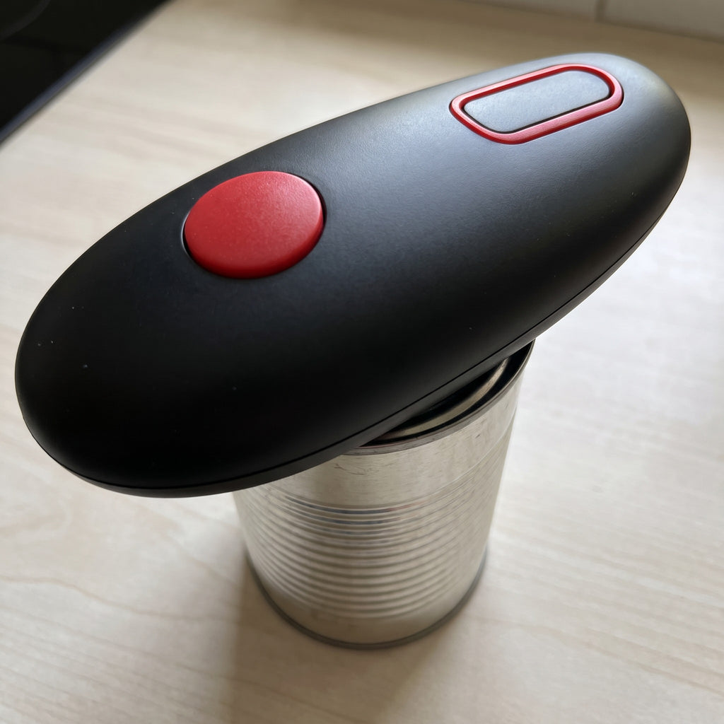 Battery-Operated Electric Can Opener for Round Oval and Square Cans - close-up of the matte black body and red button