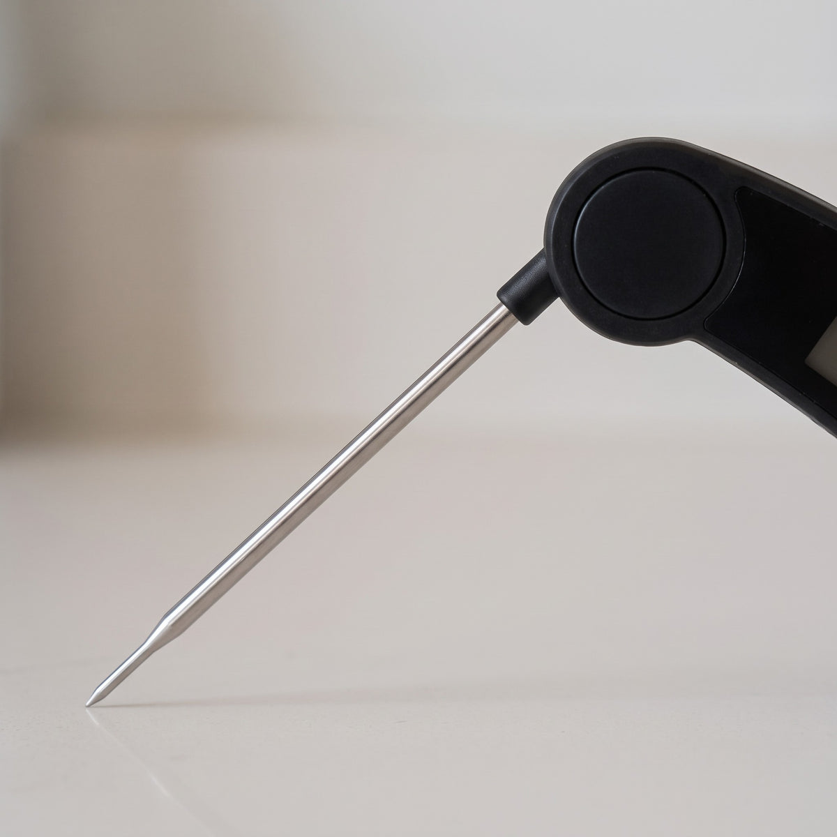 Digital Instant-Read Meat Thermometer with Probe - close-up of the folding stainless steel probe and hinge