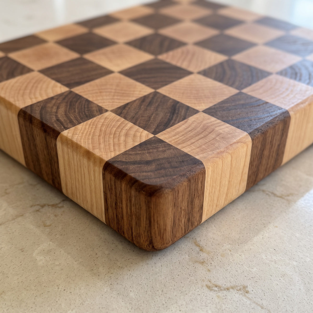 End-Grain Acacia Wood Cutting Board with Checkerboard Pattern - close-up of the end-grain acacia blocks and thick edge
