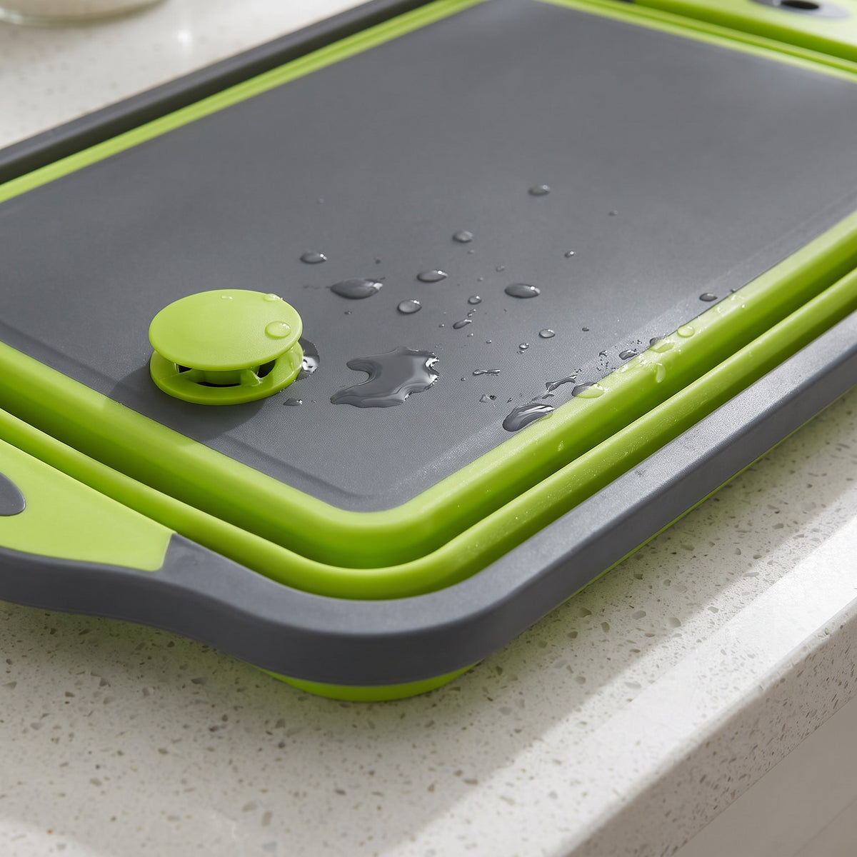 Foldable Cutting Board with Drain Hole for Rinsing and Pouring - close-up of the flexible folding frame and drain plug