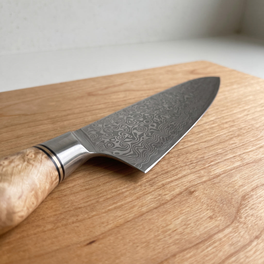 Folded Damascus Steel Knife Set with Wood Handles - close-up of the Damascus blade pattern and burl wood handle