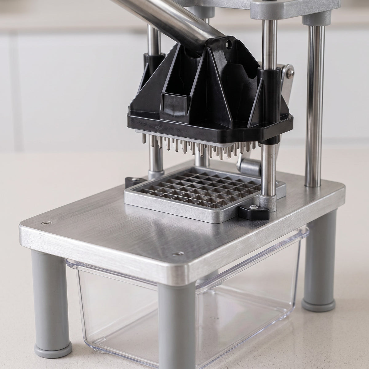 French Fry Cutter with Long Lever and Interchangeable Blades - close-up of the stainless blade grid and pusher block