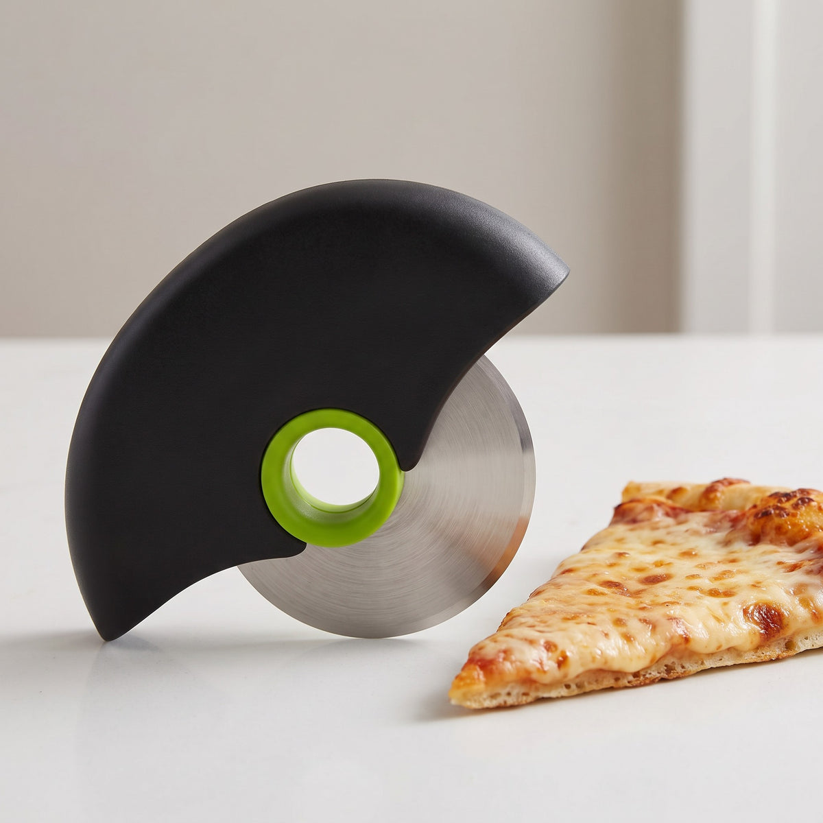 Large Stainless Steel Pizza Cutter Wheel with Cover - close-up of the stainless steel wheel and green hub