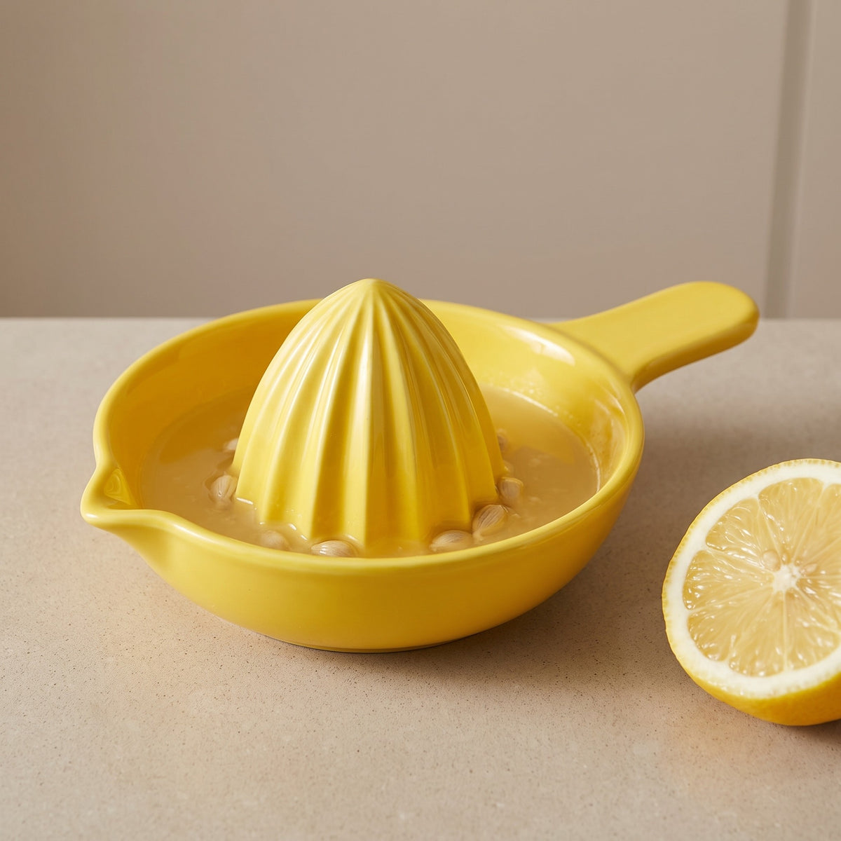 Manual Citrus Juicer with Built-In Reservoir and Pour Spout - close-up of the ribbed cone, reservoir and pour spout