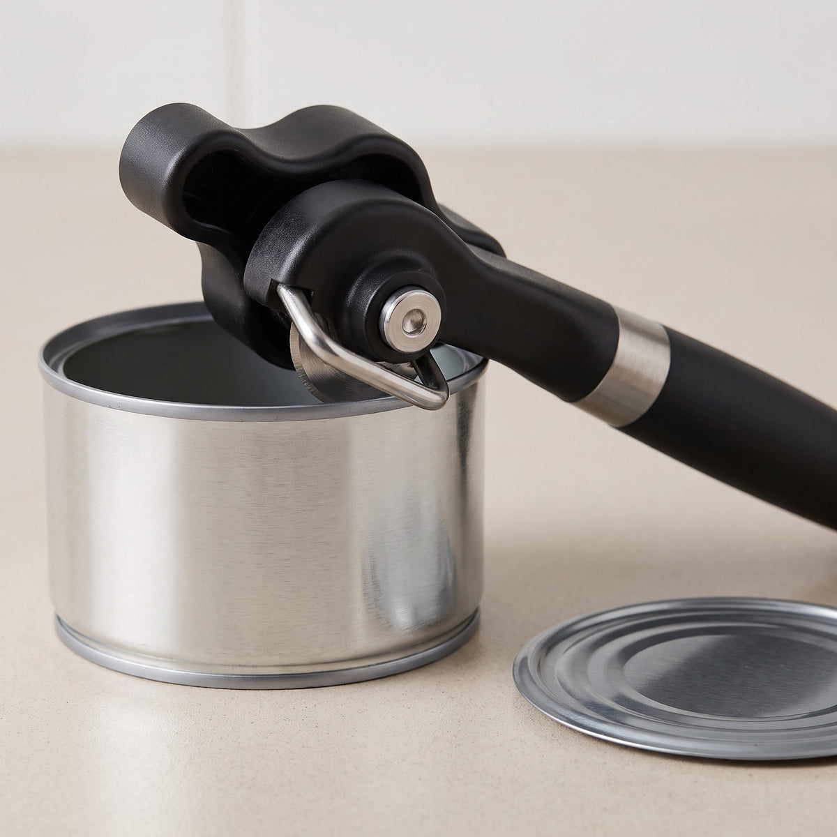 Manual Smooth-Edge Can Opener with Non-Slip Handle - close-up of the stainless steel cutting wheel and smooth-edge cut