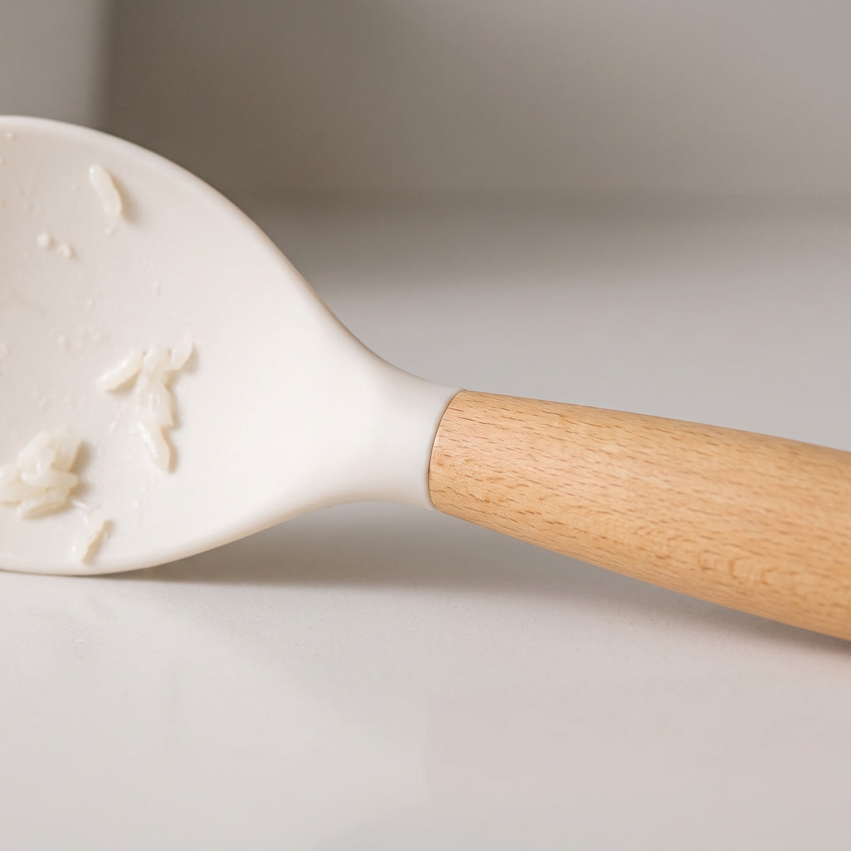 Non-Stick Silicone Rice Paddle with Wood Handle - close-up of the silicone head and wood handle grain