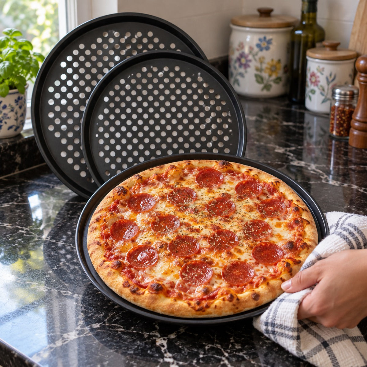 Perforated Non-Stick Carbon Steel Pizza Pan in a home kitchen