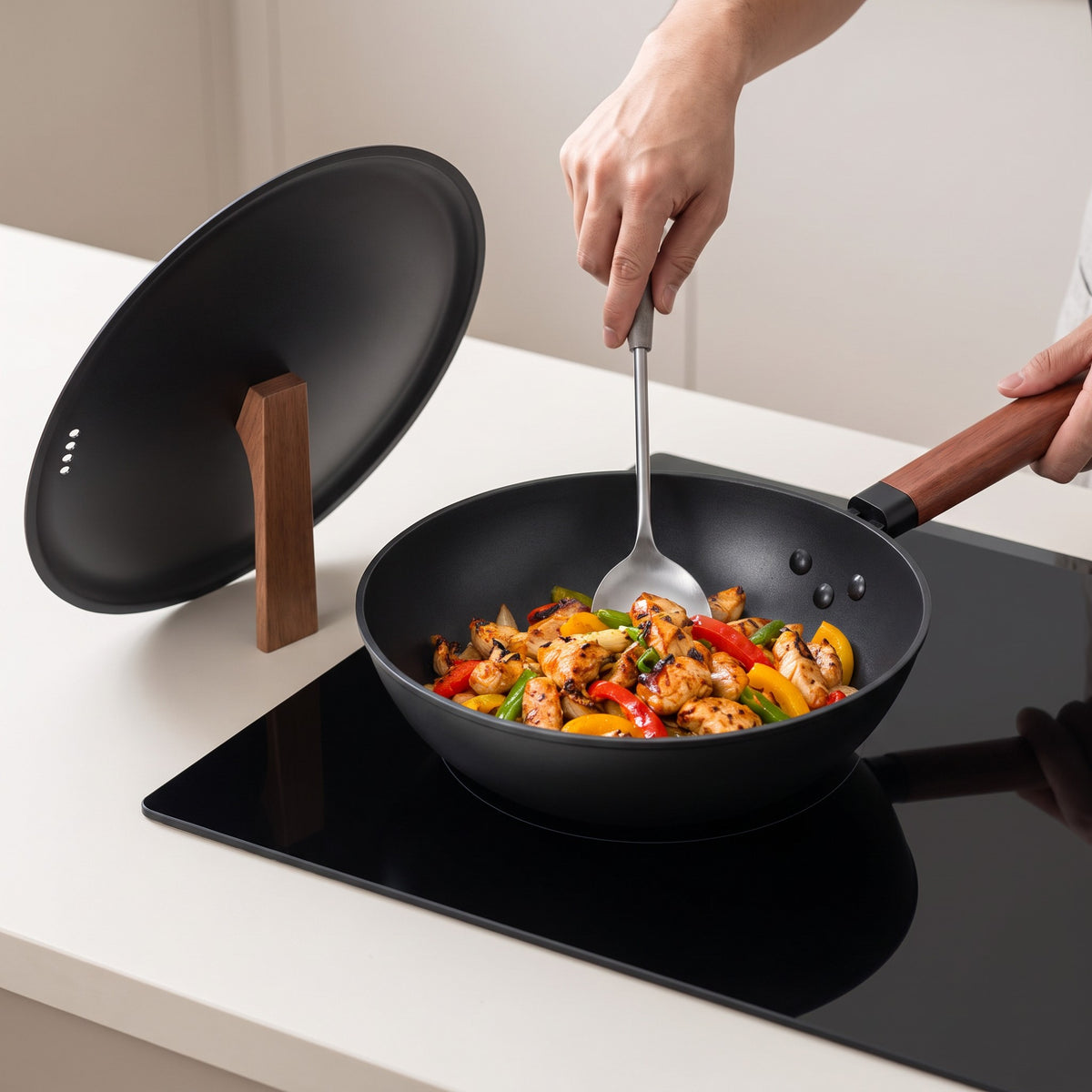 Pre-Seasoned Carbon Steel Wok with Upright Lid in use, stir-frying chicken and peppers with the lid standing upright