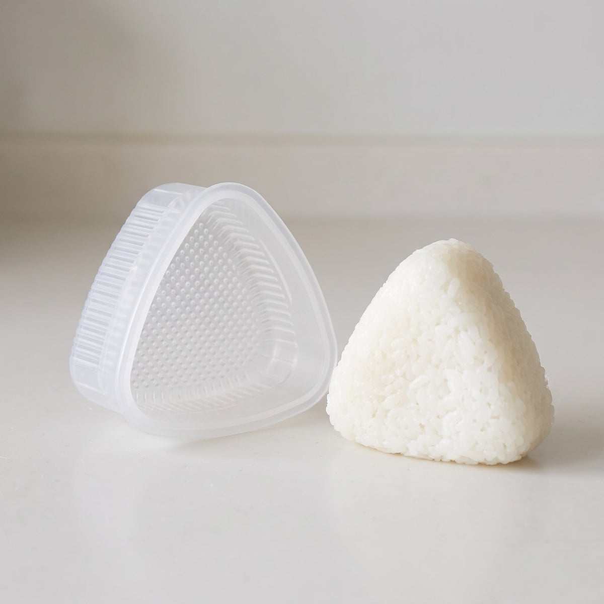 Reusable Nonstick Onigiri Rice Ball Mold Set - close-up of the frosted plastic and dotted non-stick texture