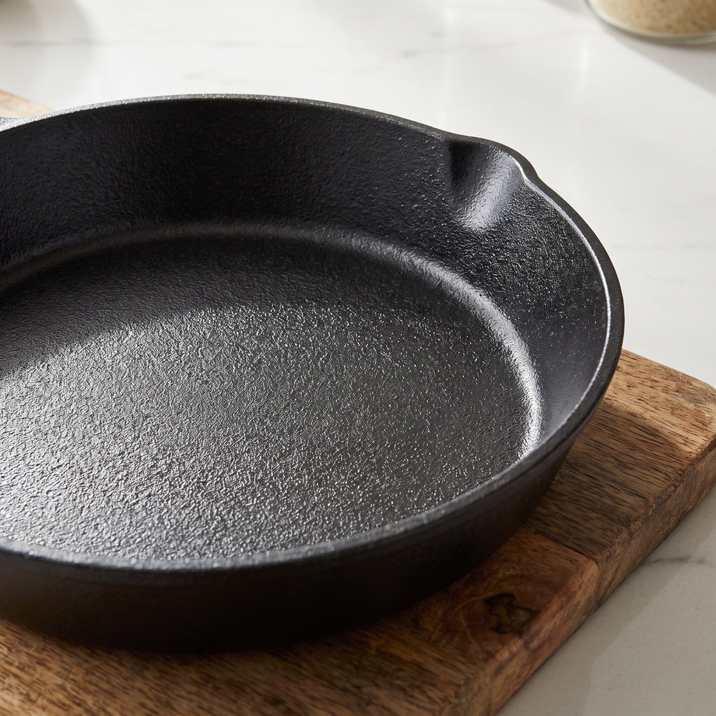 Seasoned Cast Iron Skillet with No Added Coating - close-up of the raw seasoned cast iron surface and pour spout