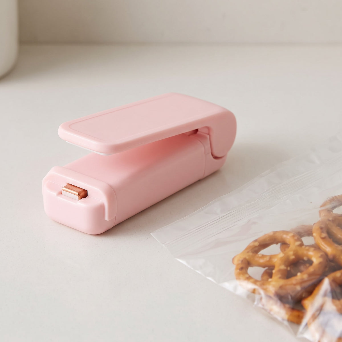 Slide-to-Seal Food Bag Heat Sealer for Chip and Freezer Bags - close-up of the sealer and a freshly sealed bag edge