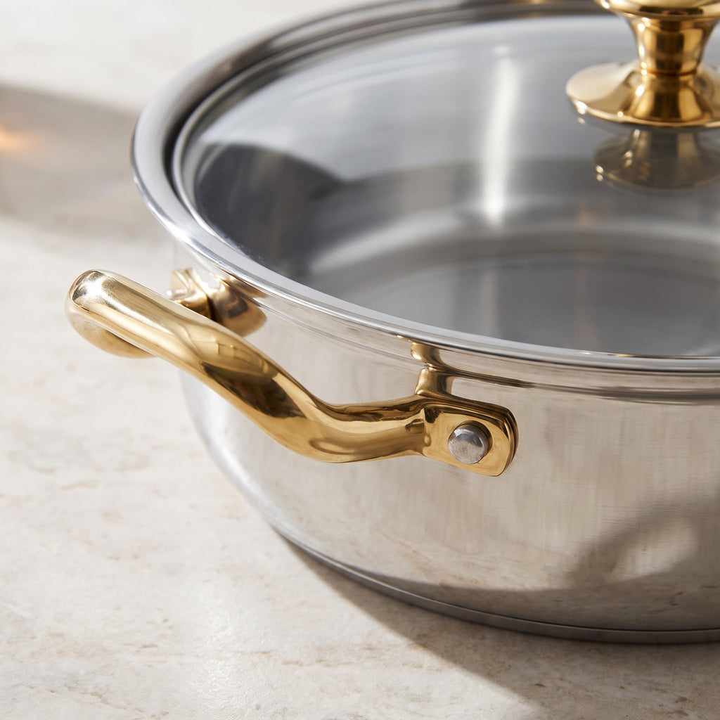 Stainless Steel Casserole Pot with Glass Lid and Flared Rim - close-up of the polished stainless steel, flared rim and gold-tone handle