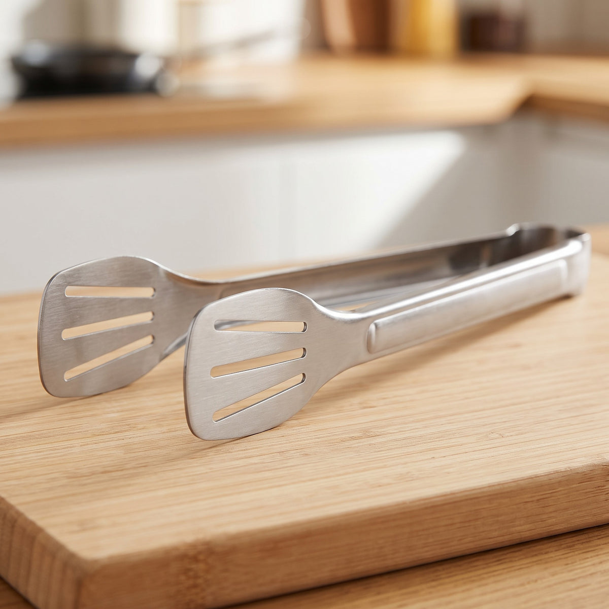 Stainless Steel Kitchen Tongs for Grilling and Serving - close-up of the brushed stainless steel slotted heads