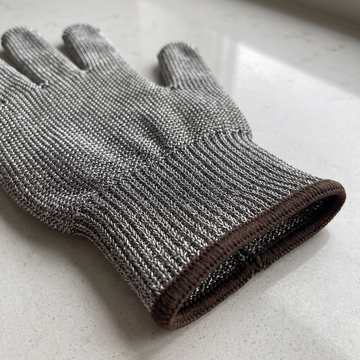 Stainless Steel Mesh Cut-Resistant Glove for Butchering and Filleting - close-up of the stainless steel wire mesh knit and cuff